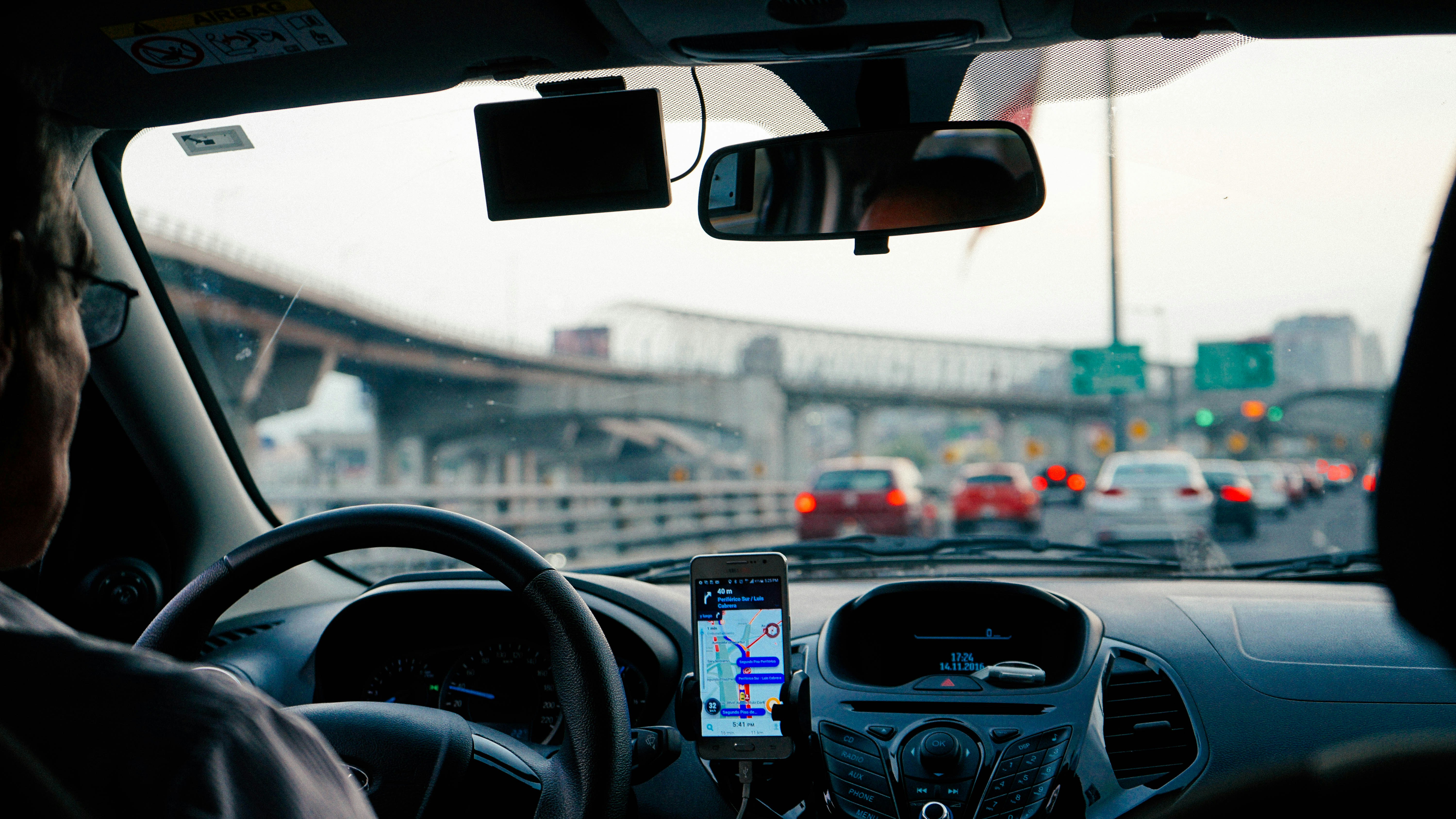 A picture of a person driving a car